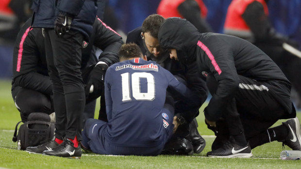 Neymar receives treatment on the field on January 23, with the injury to rule him out for 10 weeks.