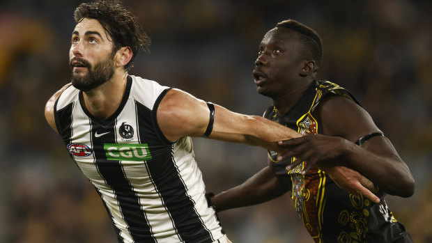 Ex-Richmond tall Mabior Chol, pictured here going head to head with Collingwood star Brodie Grundy, will boost Gold Coast’s ruck department.