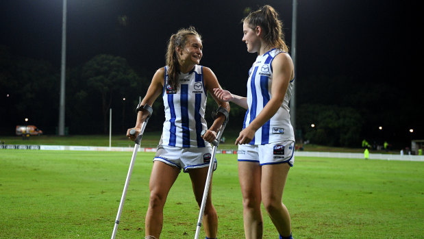 Ash Riddell (left) with crutches after Giant Nicola Barr's bump forced her off the field on Friday.