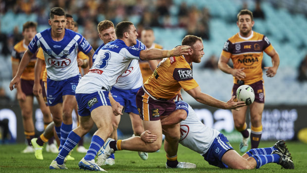 Arms free: Matt Lodge offloads in the tackle.