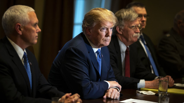 Donald Trump listens during a meeting with senior military leadership in the Cabinet Room of the White House in Washington.