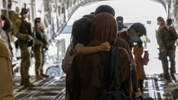 Afghanistan evacuees arrive at Australia’s main operating base in the Middle East on August 21. 