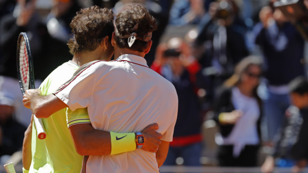 Spain's Rafael Nadal, right, is congratulated by Switzerland's Roger Federer after winning their semi-final match of the French Open tennis.