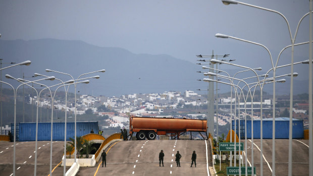 Bolivarian Army soldiers stand guard on the Tienditas International Bridge that links Colombia and Venezuela on Friday.