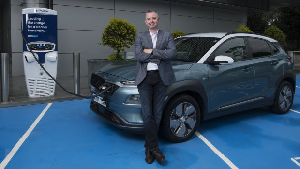 Hyundai Motor's manager of future mobility Scott Nargar with one of the carmaker's Kona EVs.