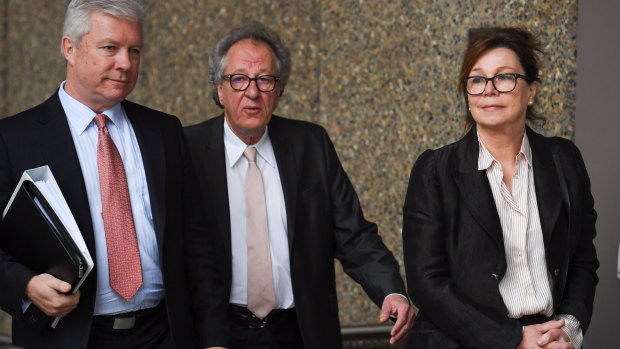 Geoffrey Rush arriving at court with wife Jane Menelaus on Monday. 