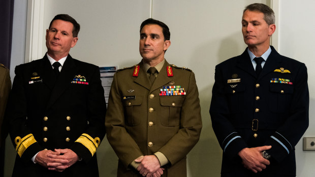 Chief of Navy Mark Hammond, Chief of Army Simon Stuart and Chief of Air Force Robert Chipman at the defence briefing on Tuesday.  