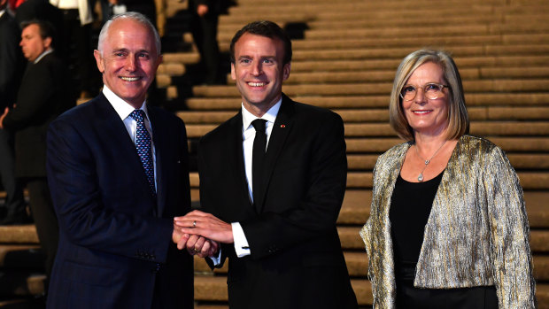 President of France Emmanuel Macron (centre) meets with Australia's Prime Minister Malcolm Turnbull and his wife Lucy Turnbull at the Sydney Opera House.