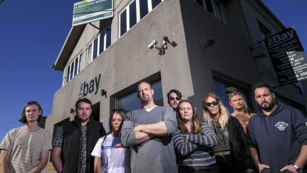 Former staff of The Bay in Mordialloc, including David Gregor (centre) rallying outside the shut-down pub.