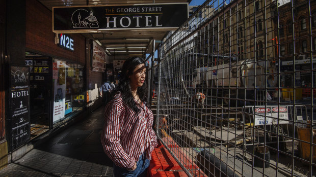Zoey Wong, who works at phone repair and accessory shop N2E is sceptical that barriers will be removed at the southern end of George Street by January. 