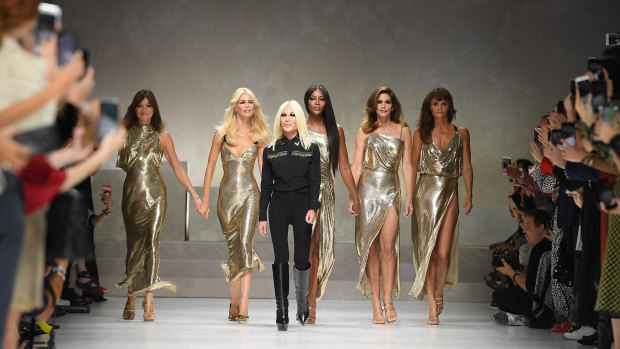 Donatella Versace leads Carla Bruni, Claudia Schiffer, Naomi Campbell, Cindy Crawford and Helena Christensen down the catwalk at Milan Fashion Week last September.