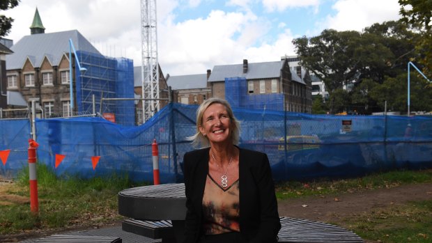 Principal of the new Inner Sydney High School, Robyn Matthews, with the school being built in the background.