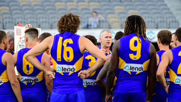 West is best: Adam Simpson addresses his team at three-quarter time during the Eagles' round one clash against the Demons.