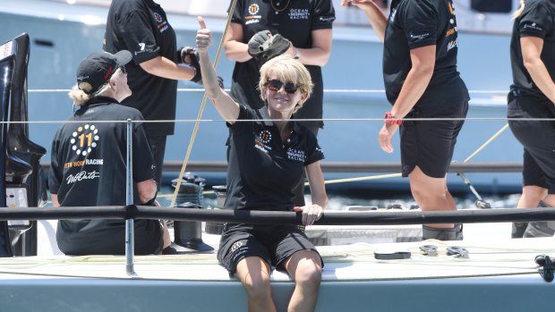 Julie Bishop gives onlookers the thumbs up as she prepares to jump off Wild Oats X.