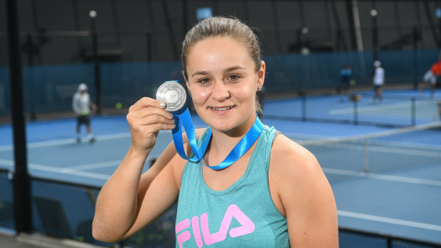 Ashleigh Barty with her second Newcombe Medal at Melbourne Park on Tuesday.