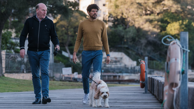 Federal Liberal MP Trent Zimmerman with partner Carlos Toledo and their dog Simba at Sawmillers Reserve in McMahons Point.