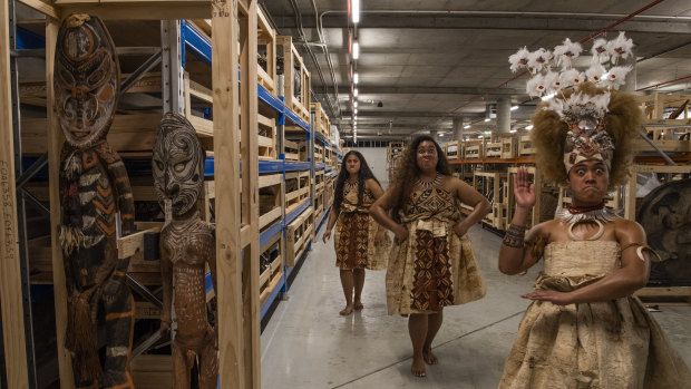 Nani Crichton, Miracle Temareti and Ashleigh Malama Pritchard of the Matavai Cultural Dance group view some of the 40,000 objects from Pacific collection in storage in Rydalmere.