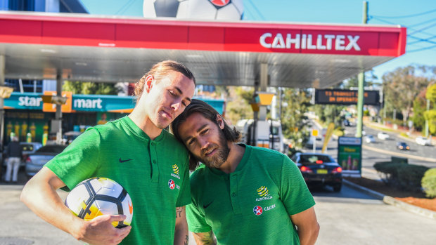 Fuelling controversy: Jackson Irvine and Josh Brilliant pose outside a Tim Cahill-themed Caltex.