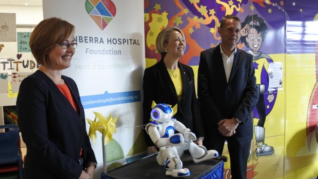 Health Minister Meegan Fitzharris, Canberra Hospital Foundation chair Debbie Rolfe and foundation board member James Willson at the unveiling on Friday of the new $25,000 robot at the Centenary Hospital for Women and Children.