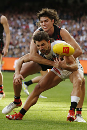 Mid-season selection Essendon’s Sam Durham tackles Collingwood’s Josh Daicos on Anzac Day.