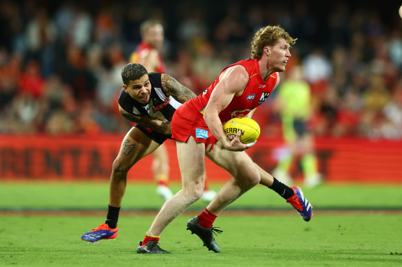 Matt Rowell of the Suns is tackled.