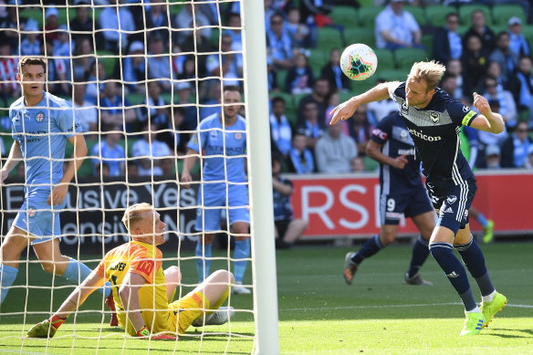 Victory captain Ola Toivonen heads his second goal past City goalkeeper Tom Glover in round 11. 
