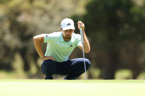 Joaquin Niemann lines up a putt at The Lakes.