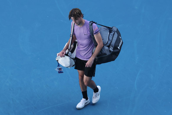 A dejected Taylor Fritz walks off the court.