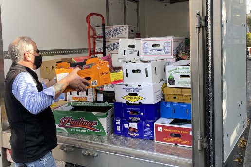 Trucks loaded at Prahran Market with produce donated by Reliable Fruit, to go to the Asylum Seeker Resource Centre. 