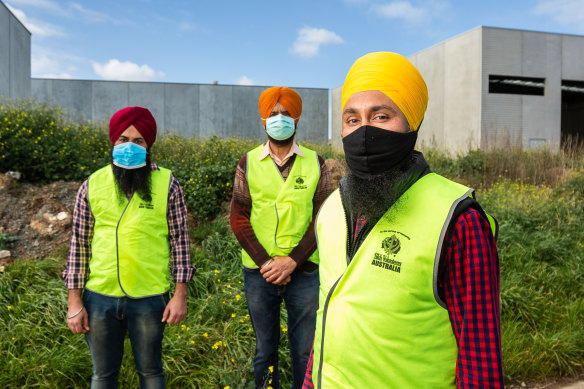 Sikh Volunteers Australia workers (from left) Simranjit Singh, Avtar Singh and Manpreet Singh.