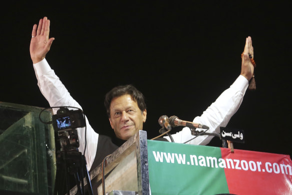 Imran Khan waves to his supporters during an anti-government rally, in Lahore, Pakistan in April 2022.