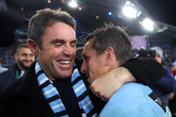 Hugging NSW coach Brad Fittler after winning the 2019 State of Origin decider.