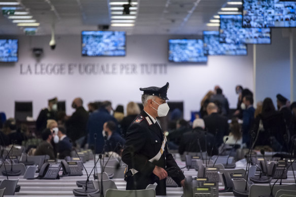 A Carabinieri police officer walks inside a specially constructed bunker ahead of the first hearing of a maxi-trial against more than 300 defendants of the ‘ndrangheta crime syndicate, near the Calabrian town of Lamezia Terme, southern Italy.