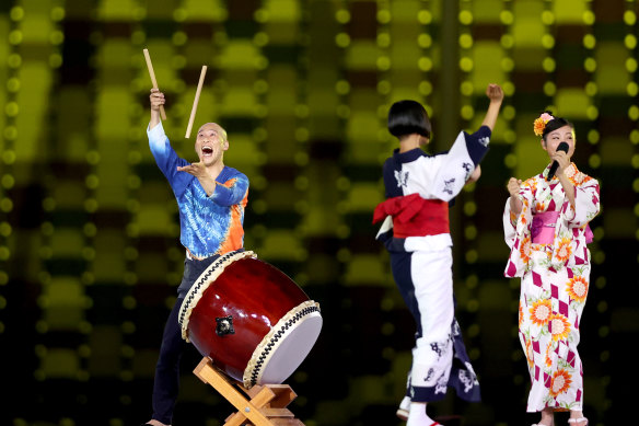 Entertainers perform a traditional song at the closing ceremony of the Tokyo Games.