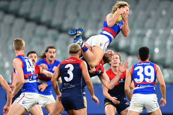 Cody Weightman soars over Max Gawn.