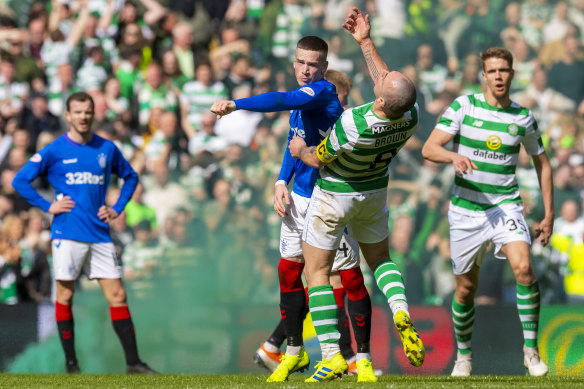 Rangers’ Ryan Kent clashes with Celtic’s Scott Brown during a combustible Old Firm derby in 2019.