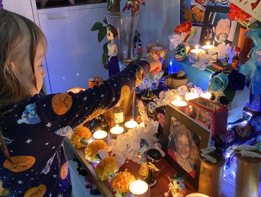 Four-year-old Matilda at the altar put up by her Mexican-born mother Monica Espinosa in their Carnegie home.