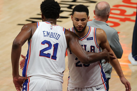 Joel Embiid has offered an olive branch to Ben Simmons (right).