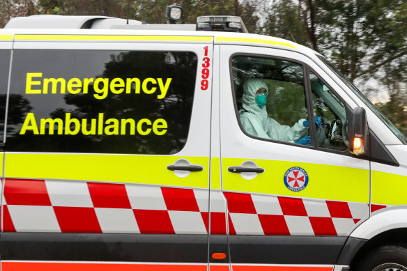 An ambulance drives out of the Anglicare Newmarch House at Caddens in Sydney's west.