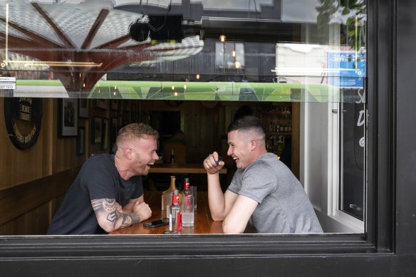 Jason Kerr and Conor Shortt enjoying a drink at Jimmy O’Neill’s in Acland Street, St Kilda. 