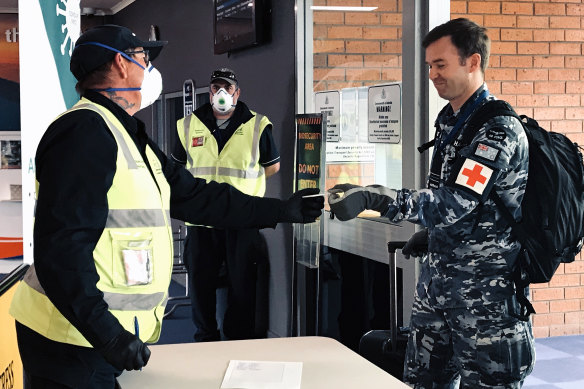 Australian Defence Force and Australian Medical Assistance team members arrive at Burnie Airport.