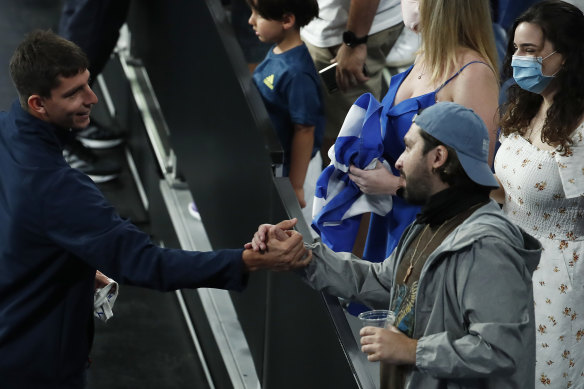 Greek player Michail Pervolarakis greets fans during day four of the 2021 ATP Cup on February 5 in Melbourne.