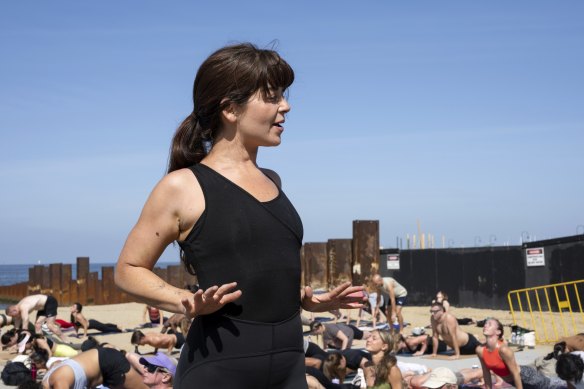 Hilmer running her yoga class on St Kilda beach on New Year’s Day.