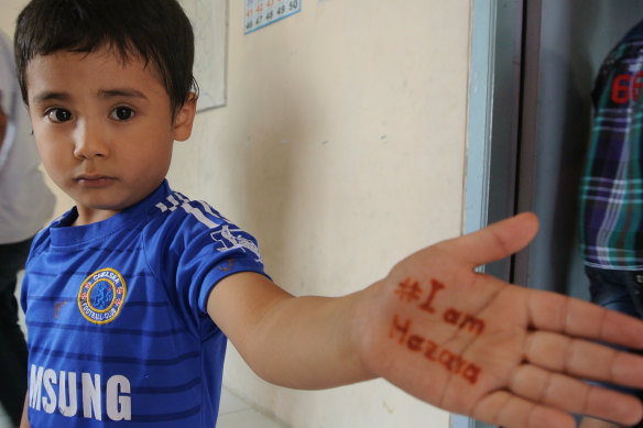 An Afghan asylum seeker child at a learning centre in Indonesia in 2014 after Australia stopped the boats. 
