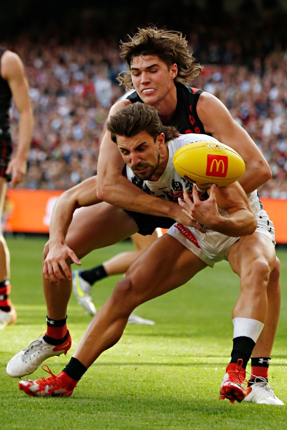 Mid-season selection Essendon’s Sam Durham tackles Collingwood’s Josh Daicos on Anzac Day.