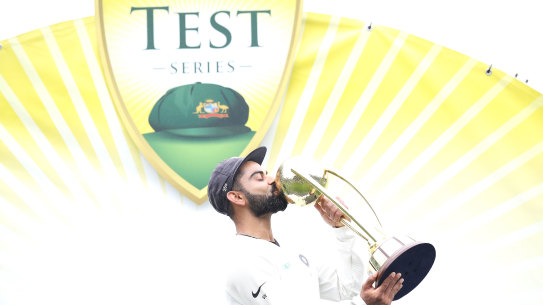 Virat Kohli with the Border-Gavaskar Trophy after their series victory in Australia when they last toured.