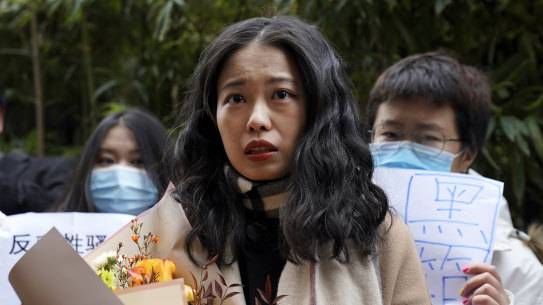 Prominent MeToo figure Zhou Xiaoxuan speaks to her supporters as she arrives at a courthouse in Beijing in December. 