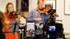 Working from home: Satu Vanska and Richard Tognetti perform in their Manly lounge room.