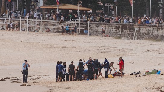 First responders performed CPR on the man while beachgoers watched from the foreshore.