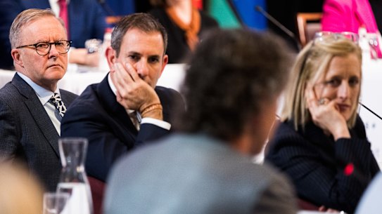 Anthony Albanese, Treasurer Jim Chalmers and Finance Minister Katy Gallagher listen to a speaker on the opening day of the jobs and skills summit.